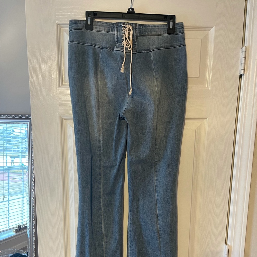Boot cut jeans, never worn, no tags.
